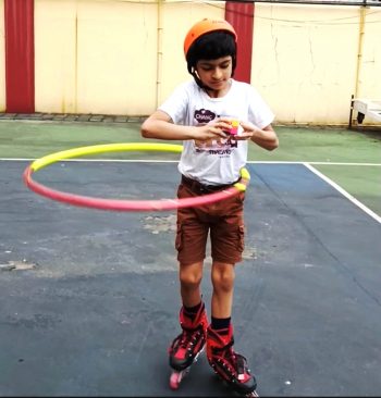 YOUNGEST KID TO SOLVE FIVE RUBIK’S CUBES WHILE DOING INLINE SKATING & HULA HOOP